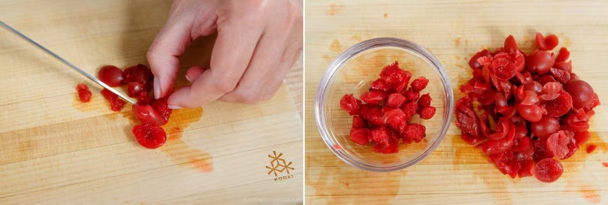 A hand slices bright red pickled plums on a wooden cutting board—just as one might prepare it for Umeboshi Onigiri (Plum Rice Ball) inspired by Midnight Diner; diced plums are shown in a small glass bowl and scattered beside it.
